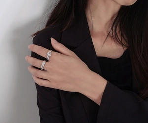 Detail of S925 silver chain rings with rectangular zircon and pave stones on model