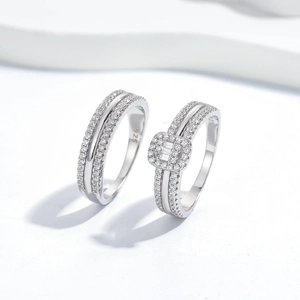 Micro shot of S925 sterling silver couple rings set with shimmering zircon stones