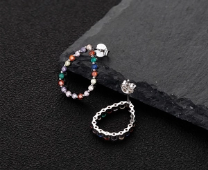 Macro detail of S925 sterling silver stamp on rainbow teardrop stud earrings