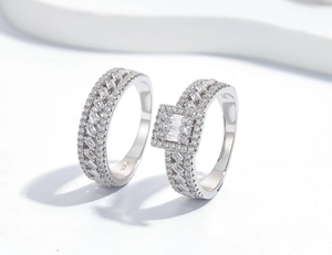 Macro shot of S925 sterling silver ring set with pave diamonds and emerald-cut stones