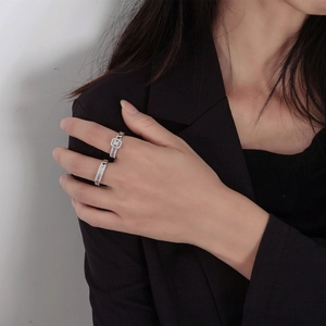 S925 silver chain rings set with cubic zirconia stones worn by a model in black suit