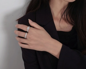 Macro shot of 925 silver halo ring set with cubic zirconia on model hand