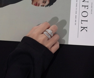 Close-up of S925 sterling silver geometric double ring set with sparkling zircons