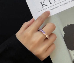 Macro shot of 925 silver ring featuring gradient purple and champagne cubic zirconia stones
