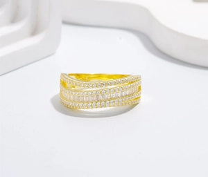 Macro detail of S925 engraved gold-plated ring with micro-pave cubic zirconia crystals