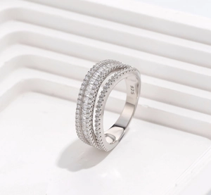 Macro shot of 925 silver ring featuring baguette cut stones and hallmark stamp