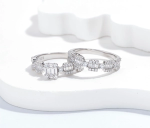 Macro detail of S925 sterling silver ring set with square and round clear zirconia