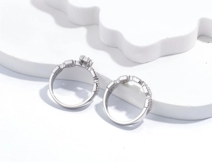 Detail of S925 sterling silver geometric bridal set with six-prong setting and pavé band
