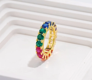 Detailed side view of 925 silver rainbow eternity ring with colorful claw-set zircons