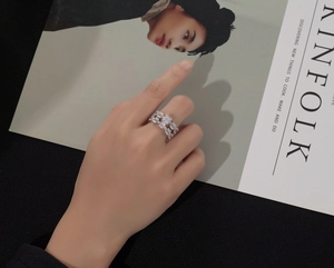 Close-up of S925 sterling silver geometric layered ring with baguette and round zircons
