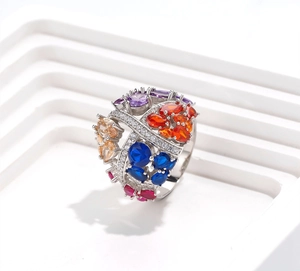 Macro shot of colorful marquise gemstone cocktail ring with 18k gold plated silver band
