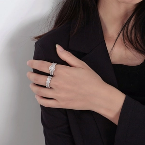 Elegant silver oval wave diamond ring set with cubic zirconia stones on model