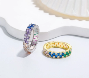 Detailed macro view of S925 silver rings showing rainbow baguette-cut zircon stones