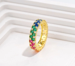 Detail of eternity band with trapezoidal colorful zircons and micro-pave white stones