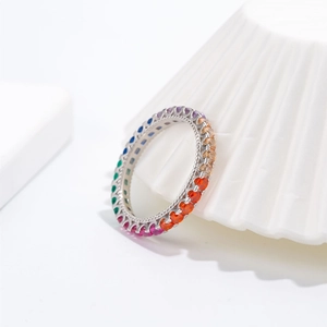 Rainbow eternity ring with 925 silver finish and colorful zircon stones on ceramic display