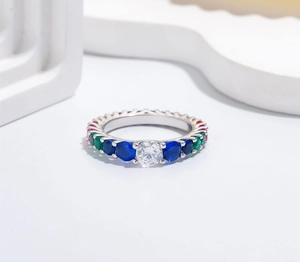 Detailed macro view of S925 silver ring featuring a white zircon and rainbow gemstones