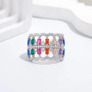 Exaggerated wide silver ring with colorful rectangular crystals and hollow wavy design