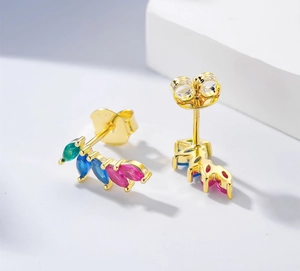 Macro shot of S925 sterling silver leaf studs with colorful marquise-cut gems