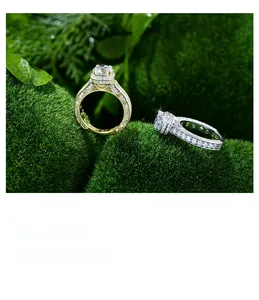 Detail shot of gold and silver S925 rings with 7mm round diamonds on natural moss background