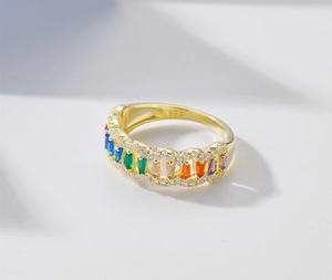 Detailed close-up of S925 sterling silver gold ring with rainbow cubic zirconia stones