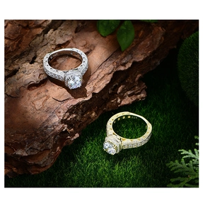 Close-up of S925 hallmark on intricate vintage rings with round diamonds and moss background