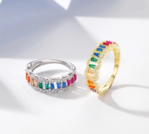 Detail of 925 sterling silver rainbow rings with colorful baguette zircon and pavé diamonds