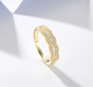 Macro shot of 14k gold plated silver ring with baguette-cut and round-cut cubic zirconia