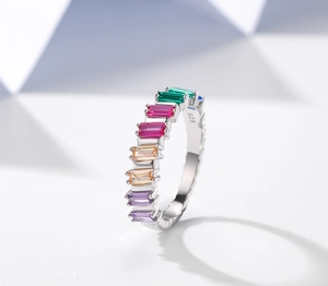 Macro shot of S925 sterling silver stamp and colorful baguette-cut stones on the ring