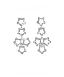 Detailed view of layered hollow star drops in 925 silver with shimmering zircon paving