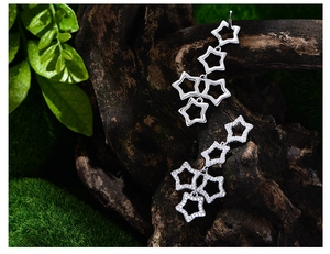 Macro shot of S925 sterling silver star drop earrings with micro-pave zircon crystals