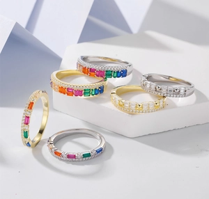Detailed view of S925 sterling silver rings with rainbow stones and luxury 14k gold finish