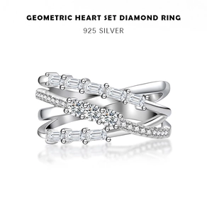 Macro view of 925 sterling silver geometric heart ring with baguette cut diamonds