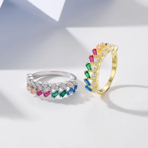 Close-up of S925 silver rings with colorful baguette stones and 925 hallmarks