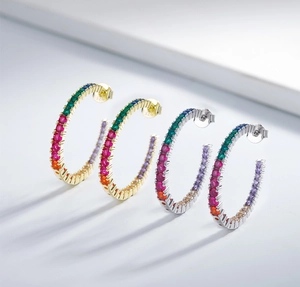 Detailed macro view of S925 sterling silver stamp on colorful zircon rainbow hoop earrings