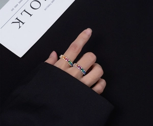 Macro view of two-piece S925 silver rainbow ring set with colorful baguette zircons
