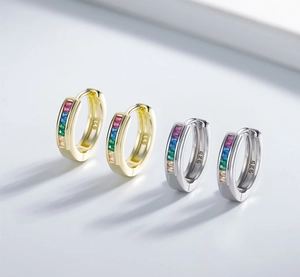 Detail of 925 sterling silver hoop earrings with channel set rainbow zircon stones