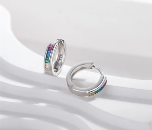 Detailed view of S925 sterling silver hoop earrings featuring baguette cut rainbow stones