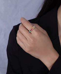 Detailed close-up of a 14k gold rainbow ring with multi-colored rectangular zircon stones