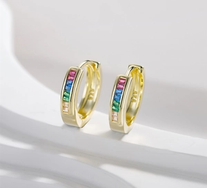 Detailed macro view of 14k gold plated S925 silver earrings with colorful rainbow gemstones