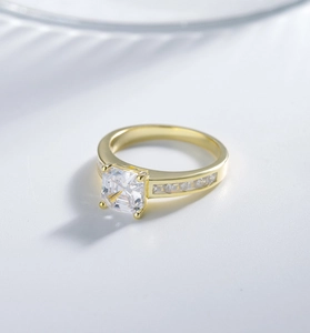 Detailed view of Asscher cut square diamond ring with side stones in 14k gold finish