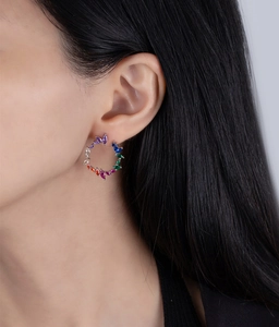 Detailed close-up of sterling silver hoop earrings with marquise-cut rainbow crystals