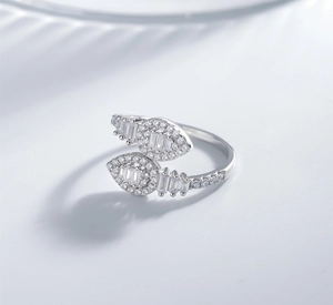 Detailed close-up of a silver ring with baguette and round pave-set crystals