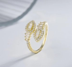 Macro shot of gold-plated S925 snake ring with cluster zircons and leaf design