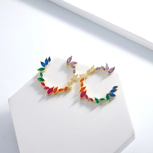 Gold olive wreath hoop earrings with colorful rainbow cubic zirconia in a semi-circle design