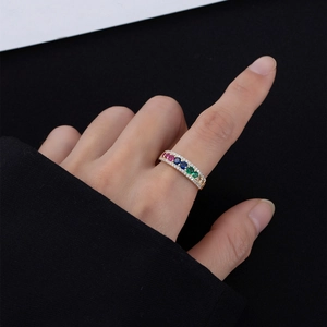 Detail of colorful gemstone ring in 925 silver with 14k gold plating and small diamonds