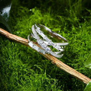 Layered 925 sterling silver ring with cubic zirconia on natural moss background