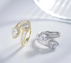 Macro detail of adjustable wrap rings with pear-cut center stones and side channel-set zircons