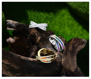 Macro shot of S925 sterling silver stamp on crisscross rings with colorful gemstones