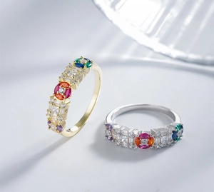 Detailed macro view of colorful gemstone rings in gold and silver plated settings