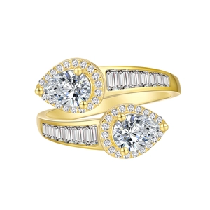 Crossed 14k gold plated ring with pear-shaped cubic zirconia and channel-set accents